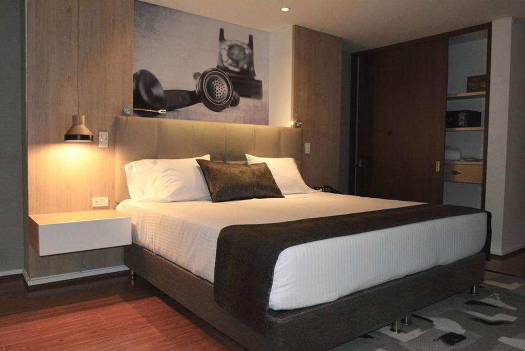 Quo Quality Hotel 马尼萨莱斯 客房 照片 A bedroom at the hotel